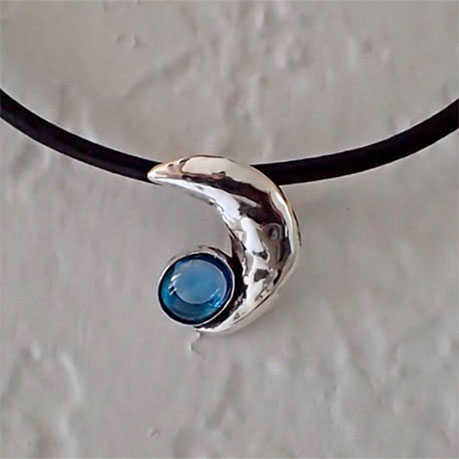 Repousse Moon Pendant in sterling silver with a 4.68 ct topaz